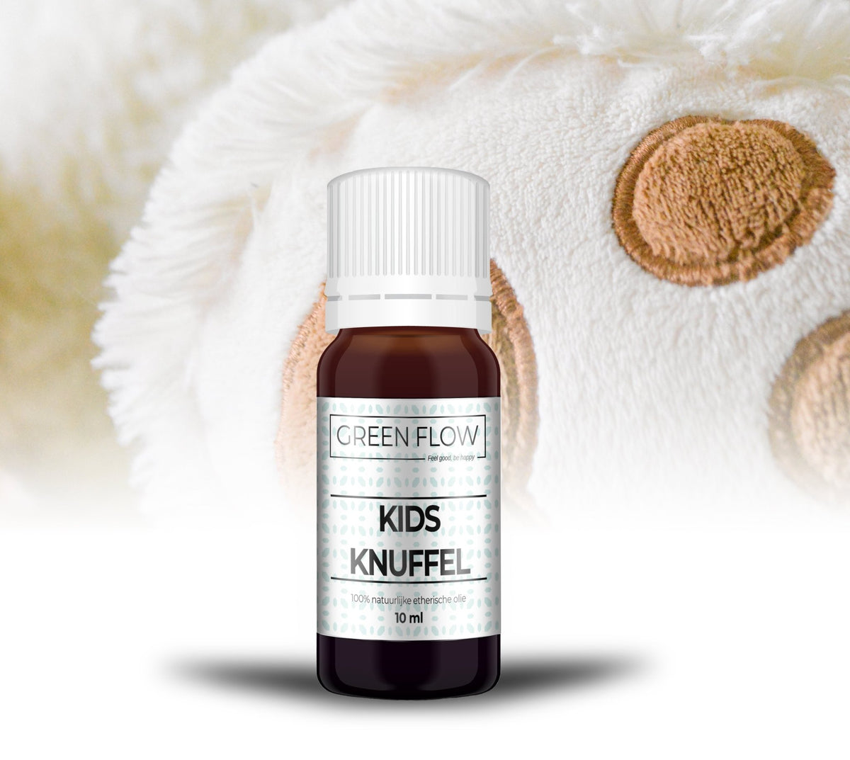 Bruin glazen flesje etherische olie van 10 ml op een zachte witte deken met beige stippen.