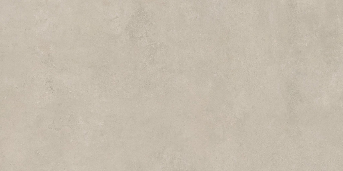 Beige betonlook vloertegel met lichte kleurverschillen in het oppervlak.