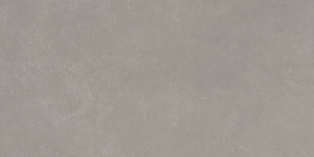 Detail van een taupe betonlook vloertegel met matte afwerking.
